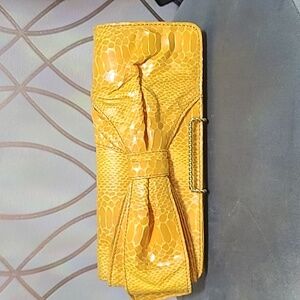Fun bright yellow bow clutch